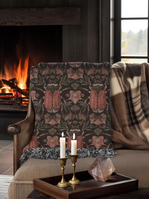 Luxurious woven cotton throw blanket featuring symmetrical scarab beetle pattern in terracotta on black background with white fringe detail. Perfect as gothic wall tapestry, dark academia decor, or cottagecore blanket for bedroom or living room.